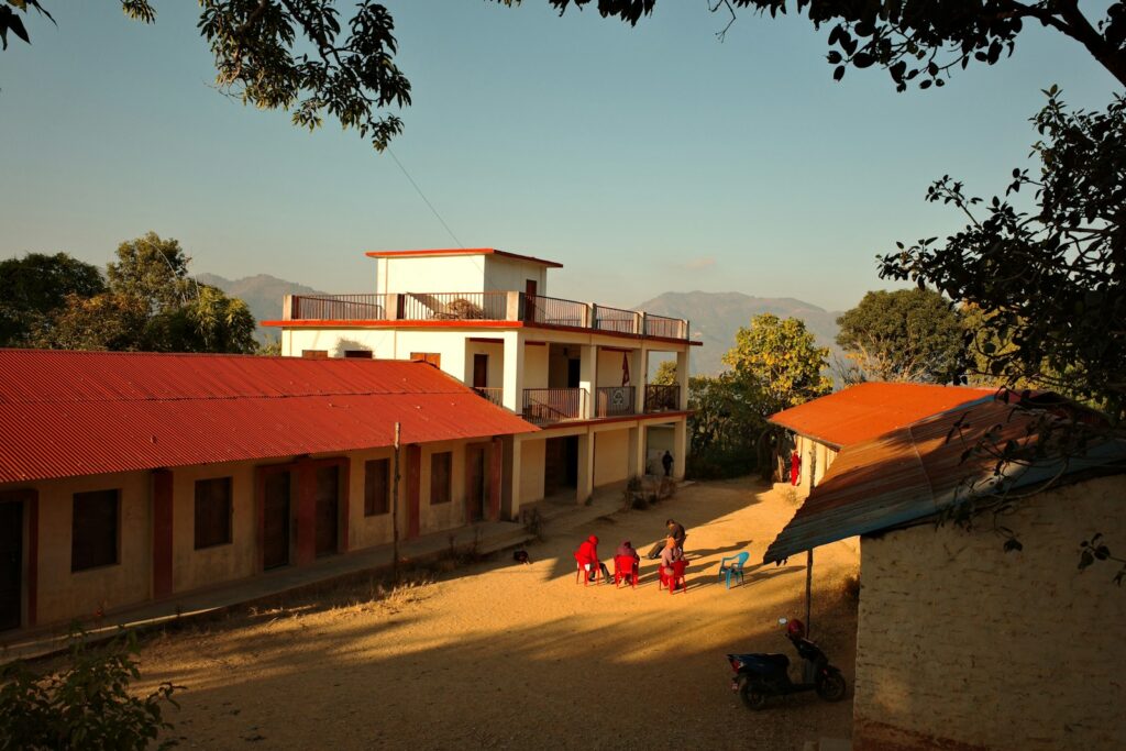 School buildings with children playing in courtyard